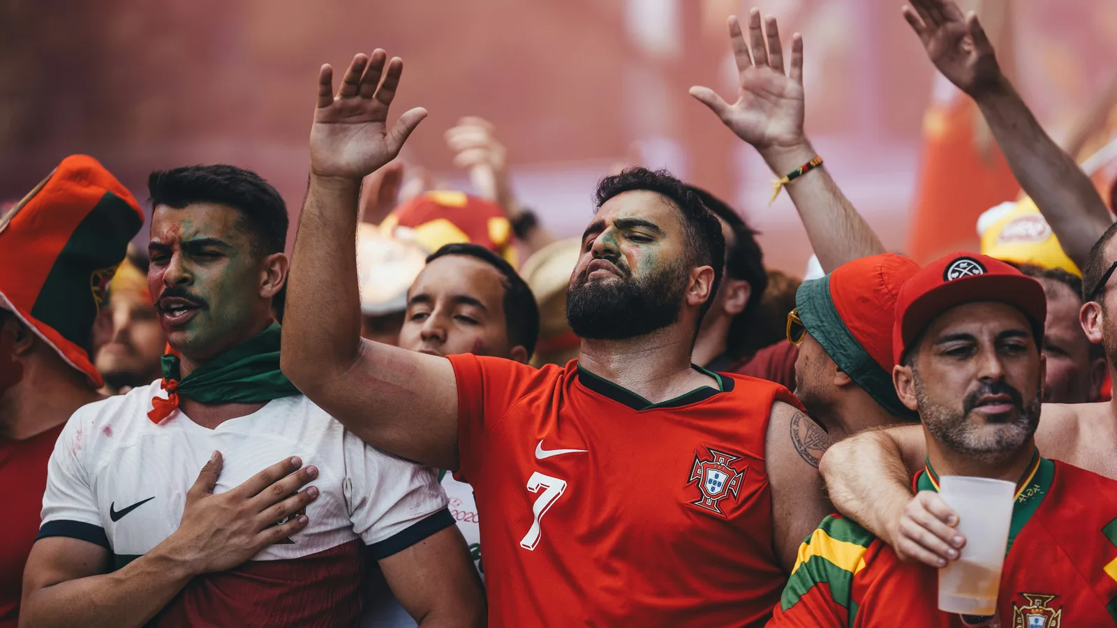 Football fans celebrating at night — South Africa return to the World Cup in 2026 after a 16-year absence, opening against Mexico at Estadio Azteca on June 11