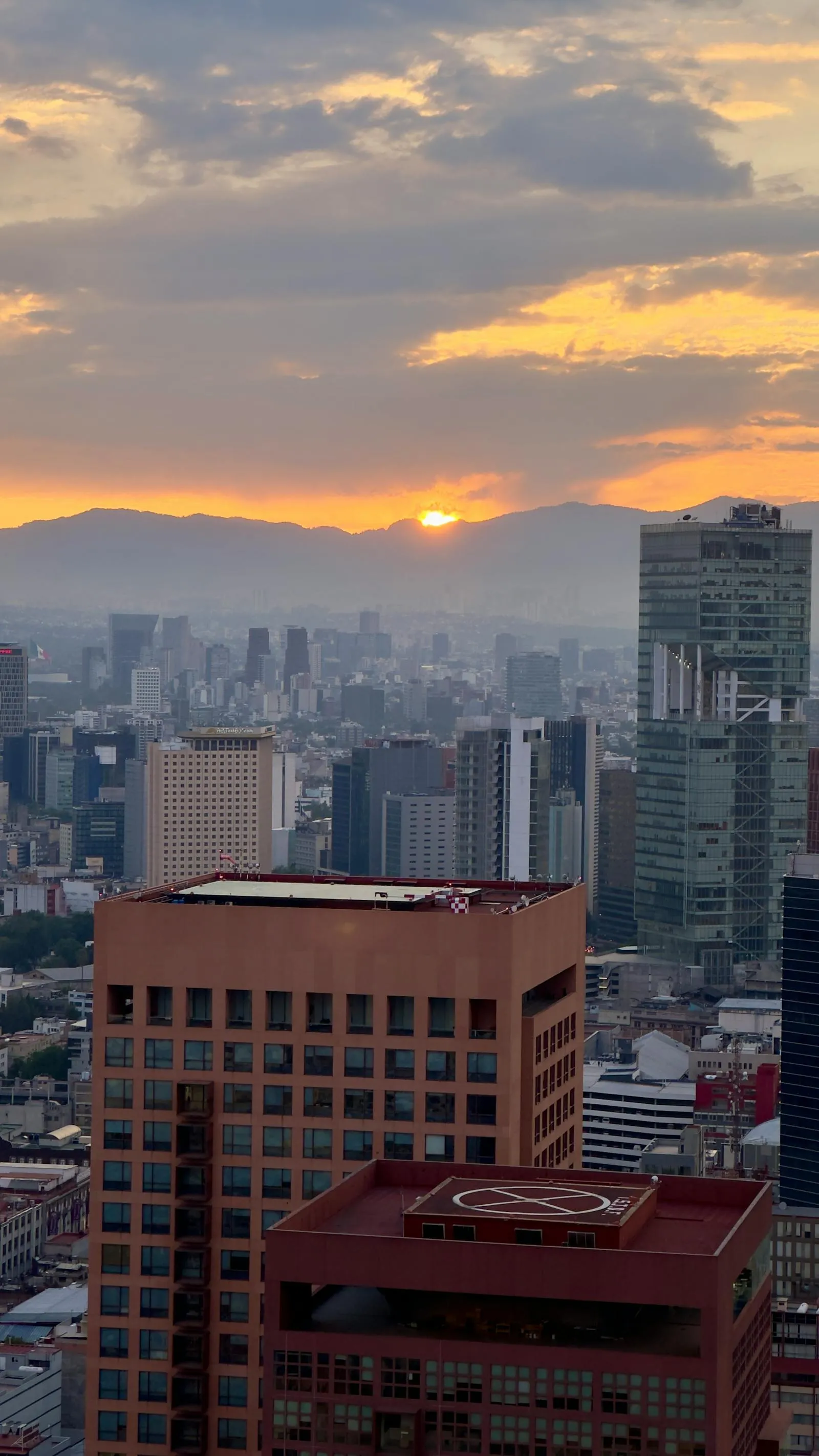 Mexico City skyline at sunset — Estadio Azteca hosts the World Cup 2026 opening match