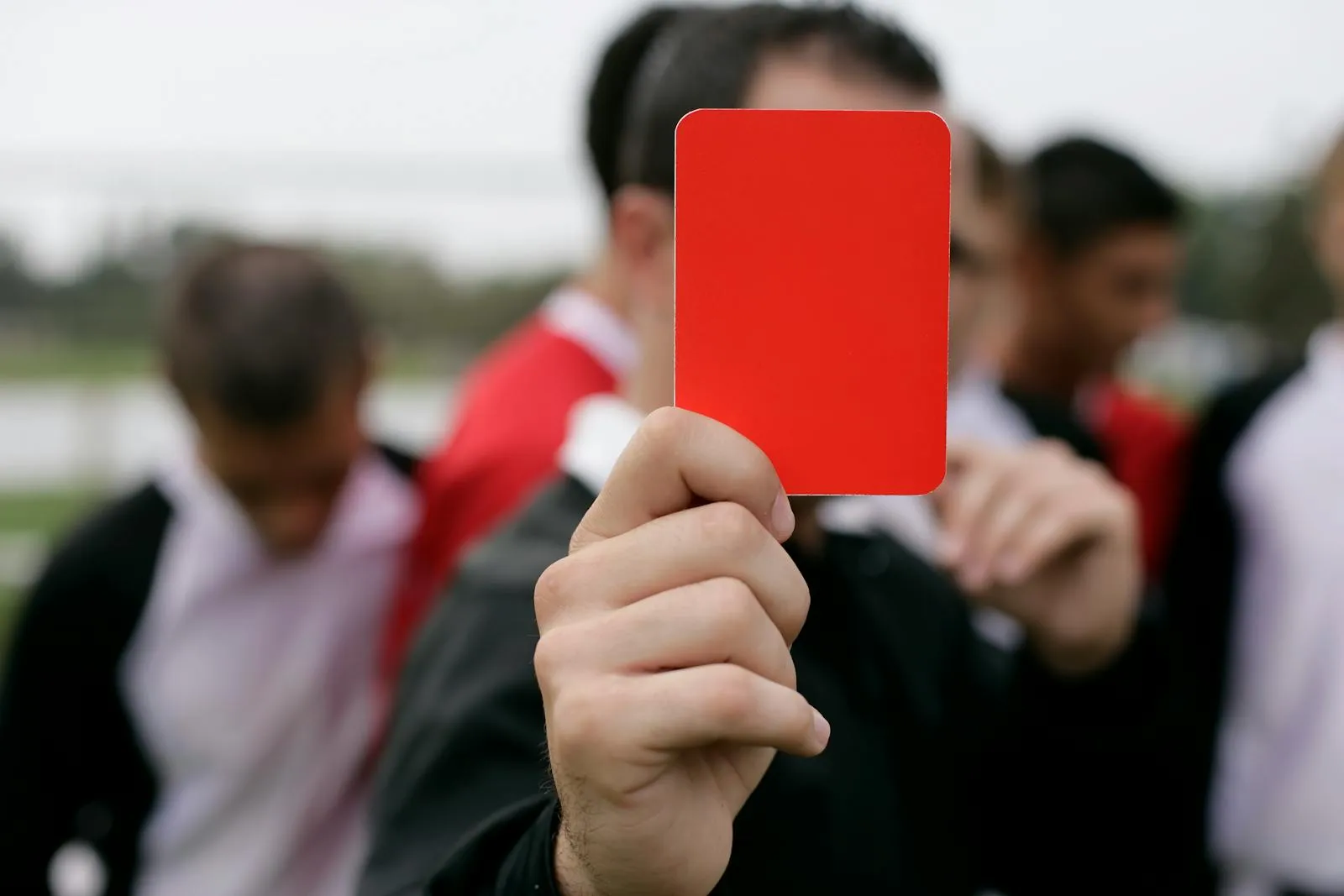 A referee's card held up pitchside — FIFA rules settle the Iran-Italy World Cup 2026 debate